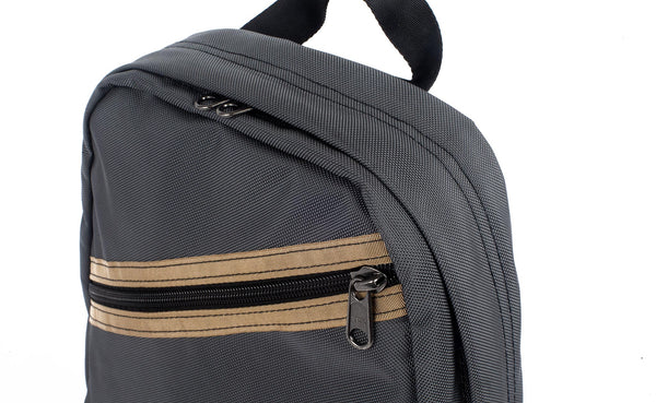 A close-up of the horizontal slash zipper with accent color strip.